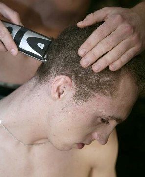 Lerry Ginter gets a military haircut