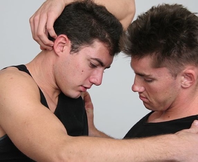 Ripped jocks rub eachothers clothed bodies