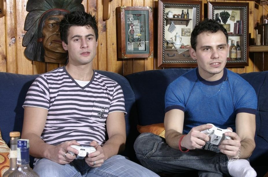Hot young guys play video games