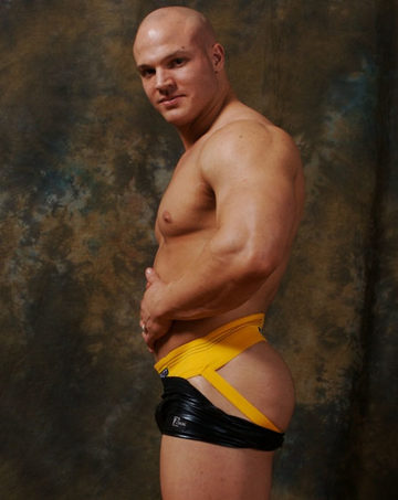 Hot young bodybuilder in a yellow jock