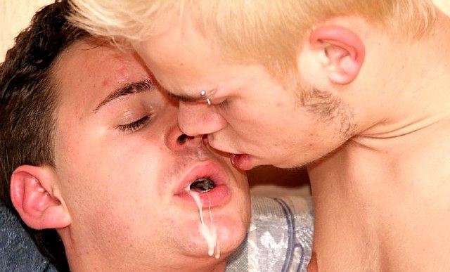 Two young guys share a cum sloppy kiss