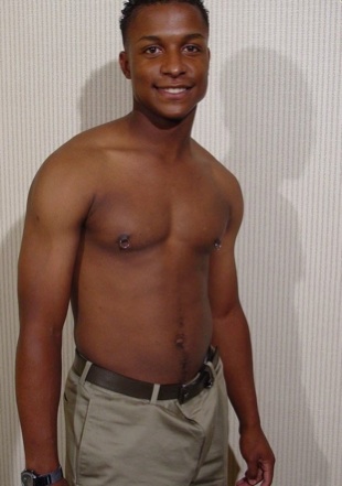Shirtless Black jock with pierced nipples