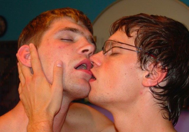Two hot young guys kissing