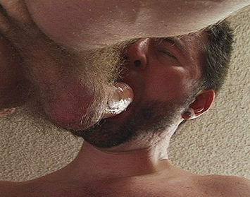 Hairy young guy with a mouth full of cock