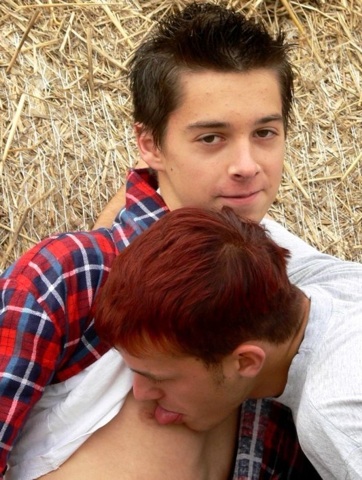 Cute young twinks play around in the hay