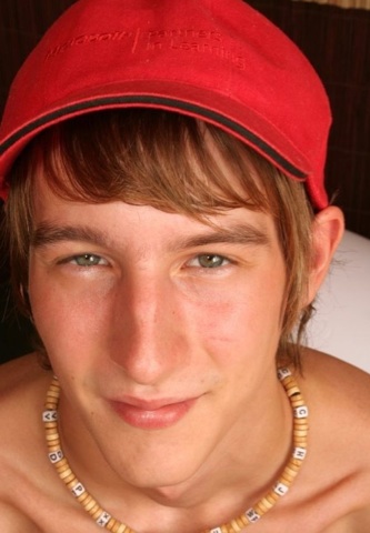 Cute young twink in a baseball cap