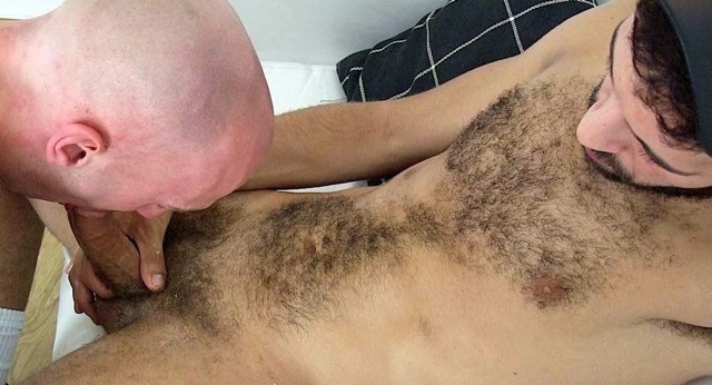 Hairy young top getting his cock sucked