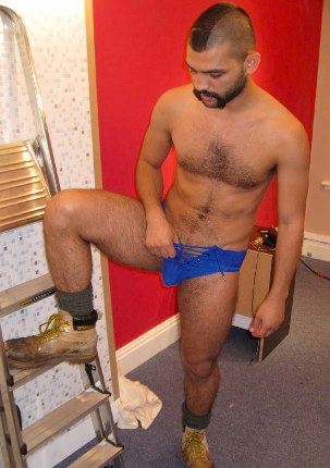 Hairy young guy with mowhawk in jock and boots