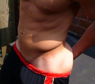 Hot toned stud shows his flat stomach and tight abs