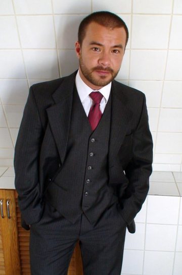 Hot masculine little guy with a beard wearing a suit and tie