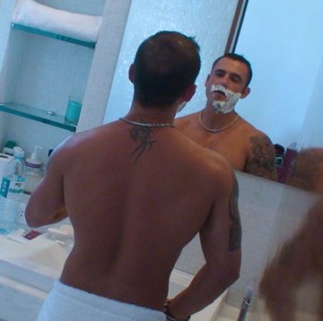 Pedro Andreas shaving in a posh bathroom