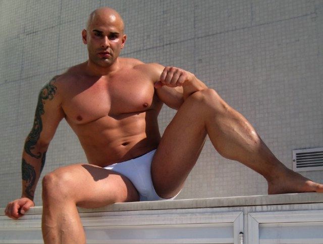 Beefy muscle man outside in underwear