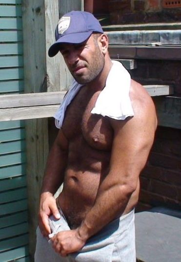 Pier Sias grabs his hard cock through his sweat pants