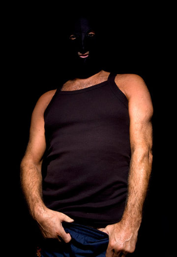 Beefy guy in mask and tank top
