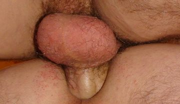close-up of raw cock deep in a shaved hole.