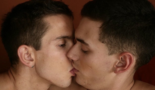 Cute young twinks kissing