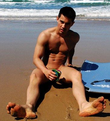 Eurasian hottie sitting at the beach naked