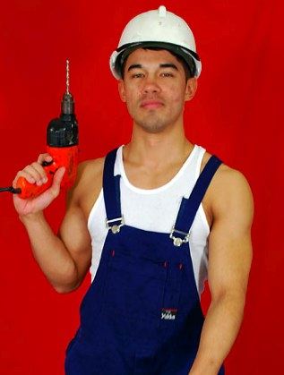 Dark muscle guy construction worker with drill