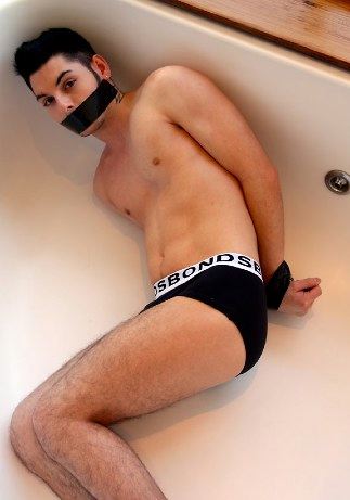 Hot young twink Clint Harrlord tied up and left in the tub
