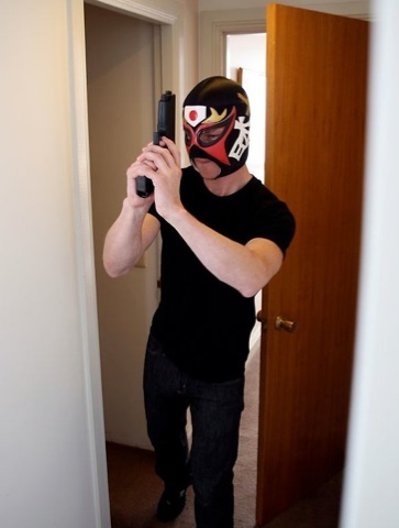 Masked Max Morcorm breaks into a hotel room