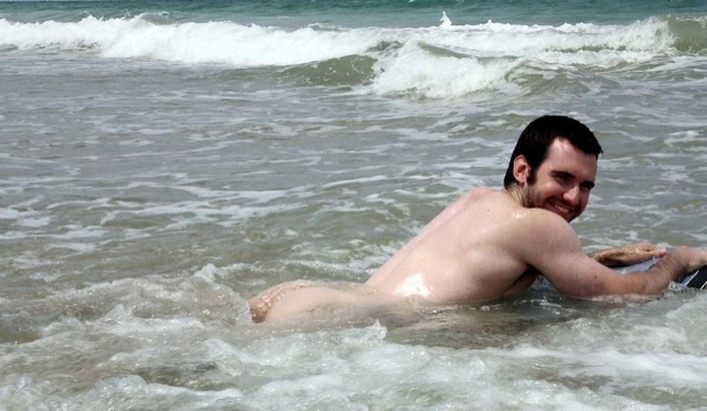 Josh swims naked in the ocean