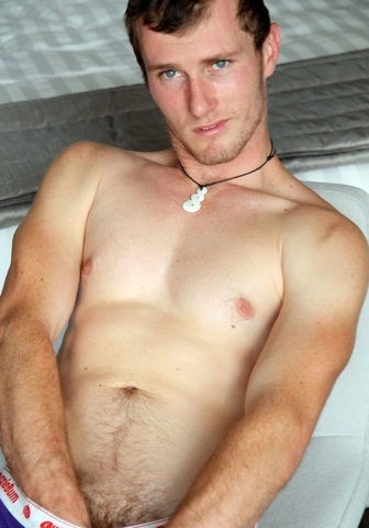 Scruffy jock plays with his cock though his underwear