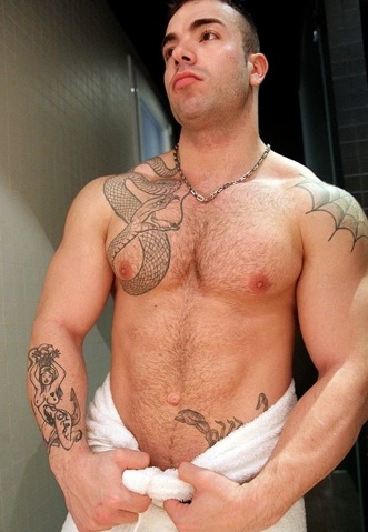 Beefy Max Hilton wrapped in a towel