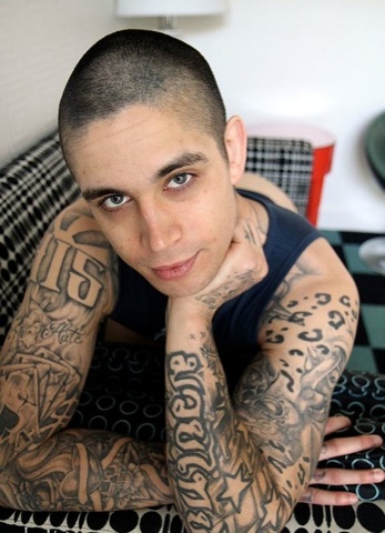Beautiful young skater punk covered in tattoos