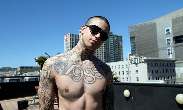Hot young shirtless skater shows off his ink