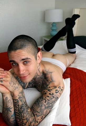 Anthony ass up on the bed in a jock and socks
