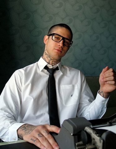 Hot young punk with tatts and glasses dressed up