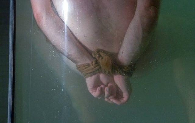 Dante's hands tied and underwater