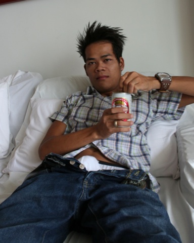 Young Asian punk drinking with pants unzipped