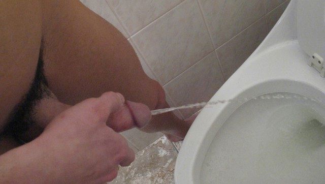Hard teenager cock pissing in the toilet
