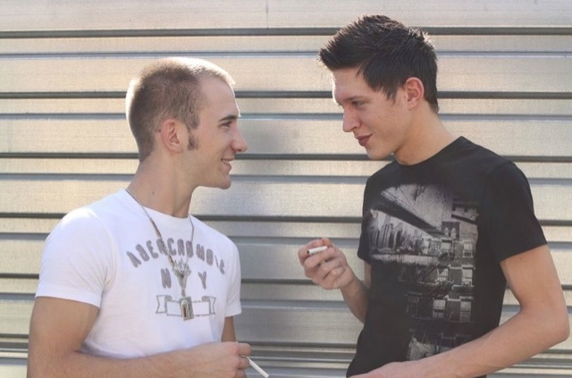 Hot young guys enjoy a cigarette together