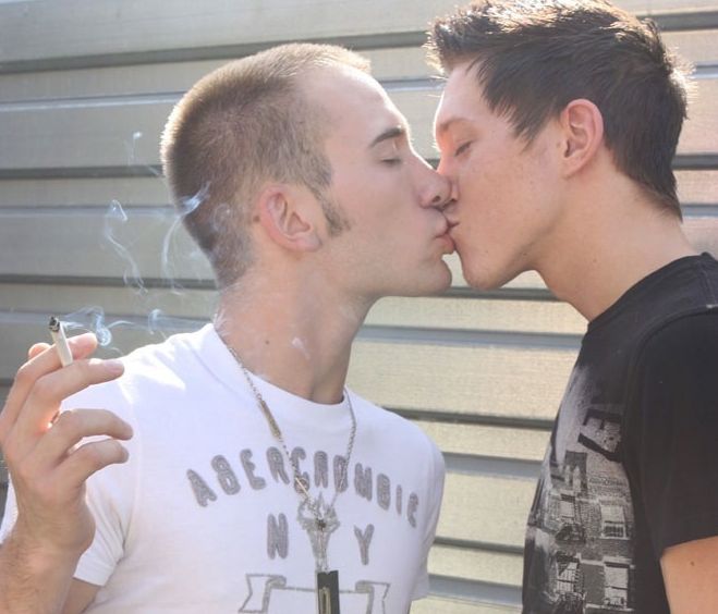 Smoking teenage boys kiss
