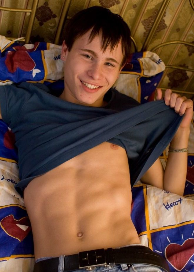 Cute young twink shows off his tight abs