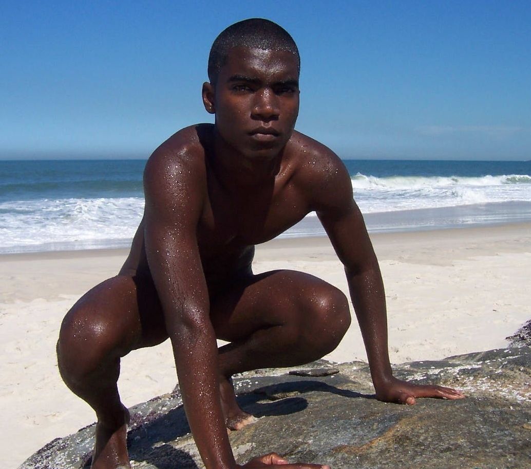 Hot black teen squatting naked at the ocean