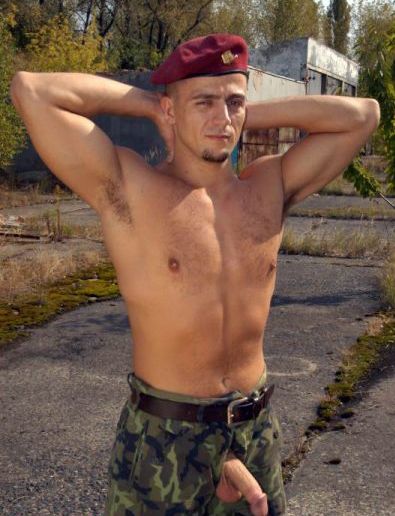 Shirtless soldier with his dick hanging out of his fatigues