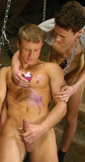 Martin Eaten pours candle wax on Victor, who holds his fat cock. 
