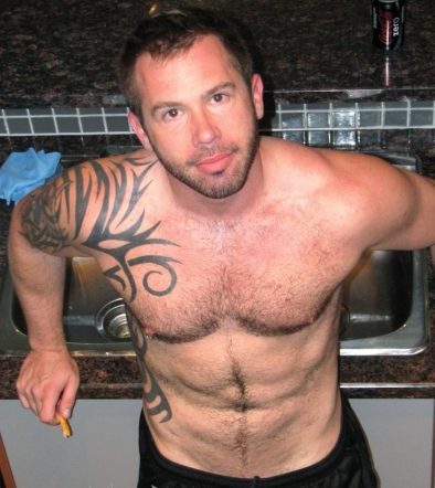 Furry inked stud pposes in his black basketball shorts