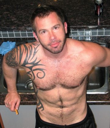Furry inked stud pposes in his black basketball shorts
