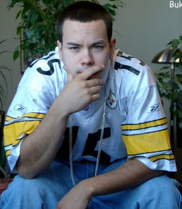 Pensive guy in a football jersey