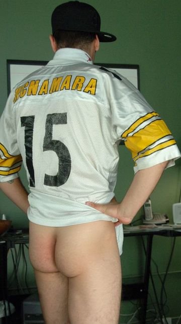 Guy in a McNamara 15 football jersey showing off his ass