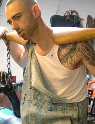 Slim hunk is restrained in his overalls and white wife beater