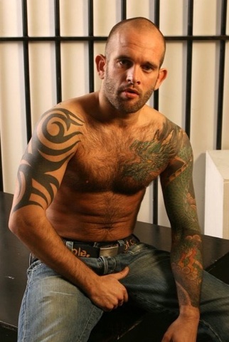 Hot hairy tattooed stud Chris Town in jeans, grabbing his dick