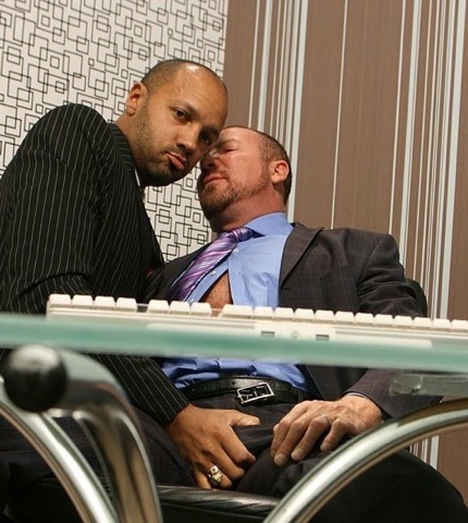 Two guys in suits get sexual at the office