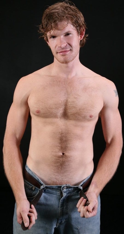 Red headed guy shows off his furry physique