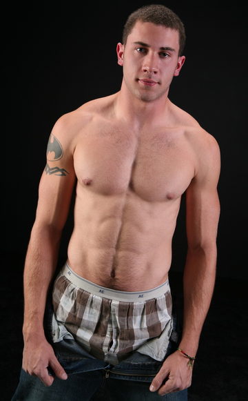 Furry muscle boy pulls down his pants