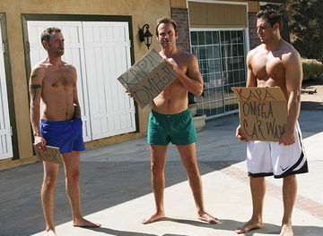 Jake Wolfe, Shawn Hunter and Pat Bateman with signs for a frathouse car wash